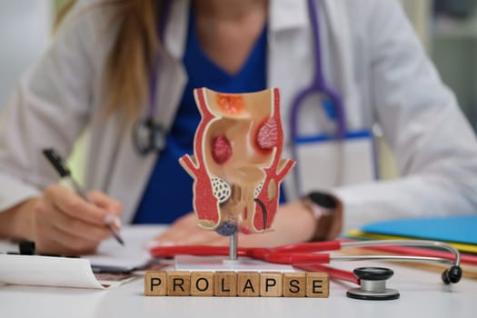 A dedicated healthcare professional carefully examines a prolapse model to enhance effective patient education and care