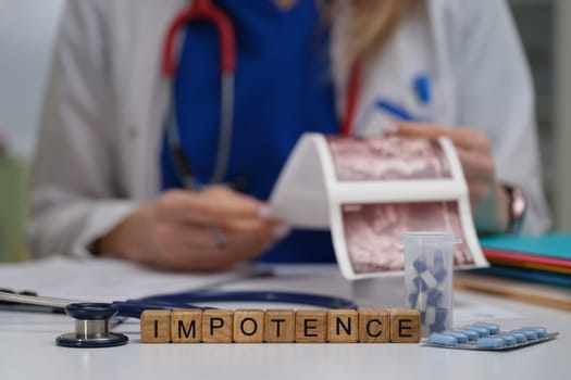 A healthcare professional discusses impotence, using medical charts and medications to enhance understanding