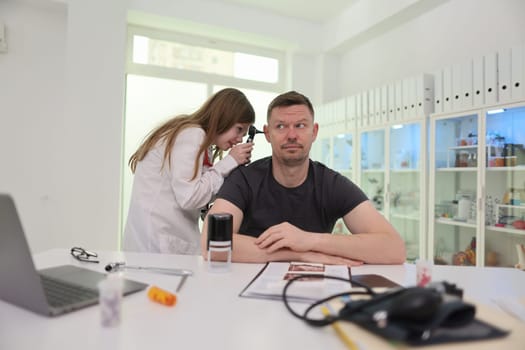 A patient is examined by a qualified doctor in a modern clinic setting that prioritizes health and comfort