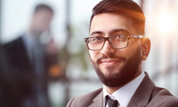 Close-up portrait of a dedicated young businessman