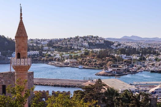 View from Castle on Bodrum city, green mountains, blue sea and port with yachts. Traveling concept