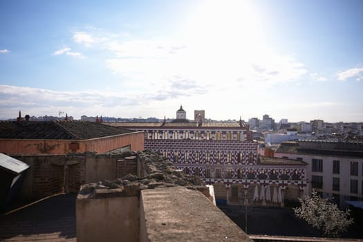 Scenic panorama of Plaza Alta in Badajoz, Spain, with traditional architecture, historic rooftops, and urban skyline under a bright afternoon sun.