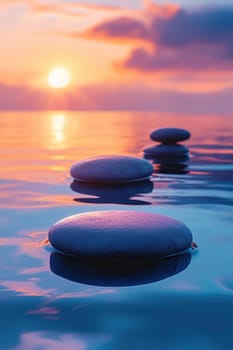 Photo of balanced stones in the sea at sunset symbolizing harmony and balance for meditation or spa with beautiful sunset light and blurred background.