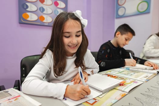 Group of elementary students studying at language school.