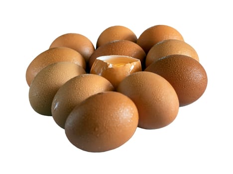 Egg yolk in Broken raw chicken eggshell in the among of Fresh chicken egg (Hen egg) isolated on White background with clipping path. Natural organic fresh eggs for healthy food, use it as your Space for text, Design, Wallpaper and Poster, Selective focus.