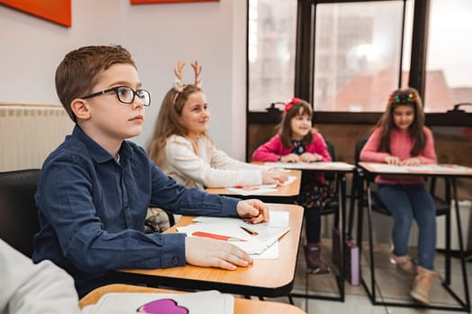 Group of elementary students learning together at language school.