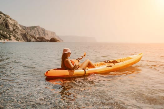 Kayak sea woman. Happy attractive woman with long hair in red swimsuit, swimming on kayak. Summer holiday vacation and travel concept