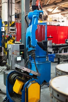Automatic Industrial welding robot in a modern factory in operation.
