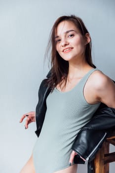 Beautiful fashionable woman in black leather jacket