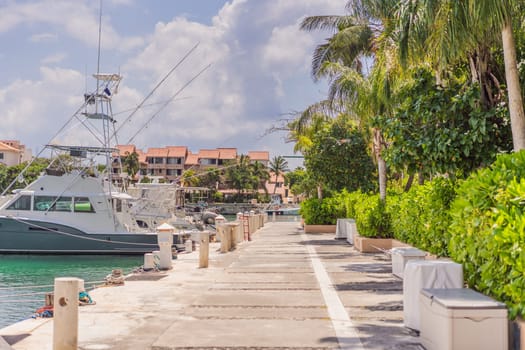 A scenic marina filled with luxurious yachts docked in calm waters, reflecting the beauty of a coastal lifestyle. A serene and elegant setting representing travel, wealth, relaxation, and nautical adventures.