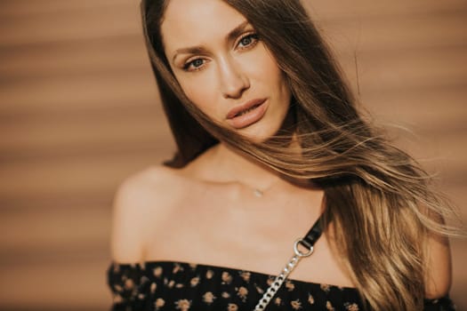 Outdoor portrait of sensual long hair brunette woman