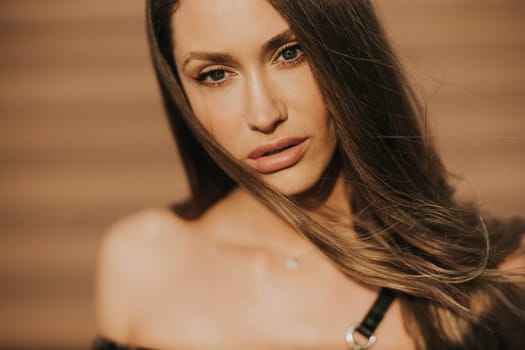 Outdoor portrait of sensual long hair brunette woman