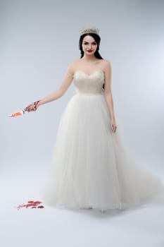A striking woman in a beautiful white wedding gown holds a bloody knife, embodying a darkly enchanting bridal fantasy.