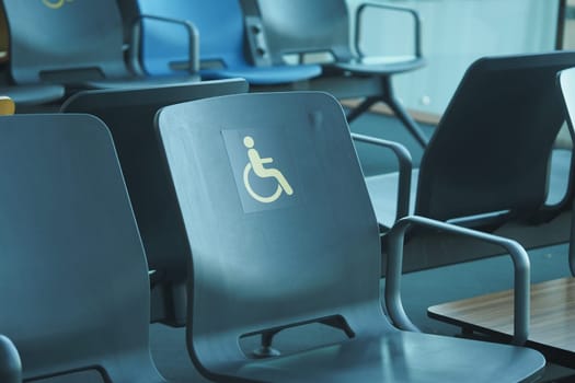 Accessible seating is available in a waiting area with modern chairs.