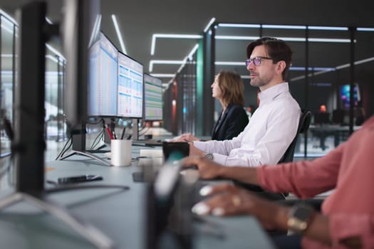 Business Team Completing Billing Report Using Spreadsheet Software on Computers