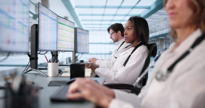 Multiracial Medical Team Manages Billing Codes Using Online Spreadsheets