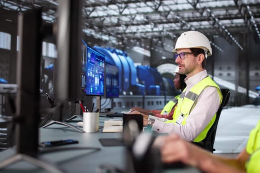 Skilled engineers monitoring gas pipes control with advanced SCADA software.