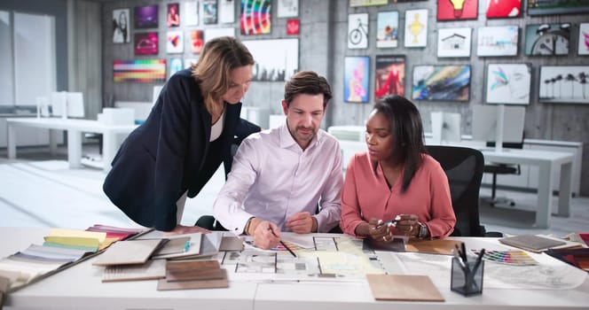 Expert Architects Collaborating on Blueprint for Modern Custom House Remodel.