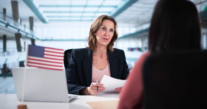 African lawyer assists older woman with US immigration application approval.
