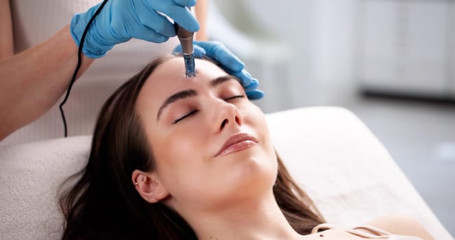 Dr. Smith Performing Microneedling Mesotherapy on Young Woman at Clinic