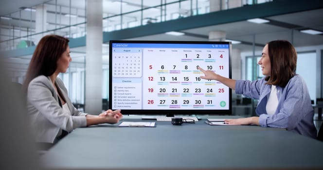Scheduling appointments online for a busy businesswoman's packed calendar.