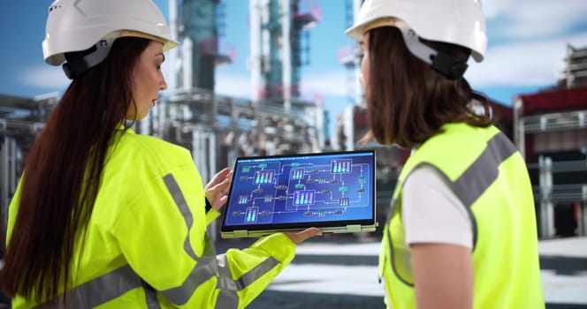 young female engineer inspects oil and gas plant for OSHA compliance.