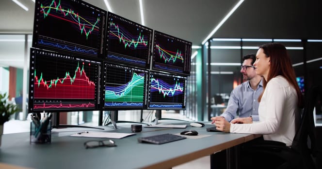Trading Shares in a Busy Stock Market Exchange on Monitors.