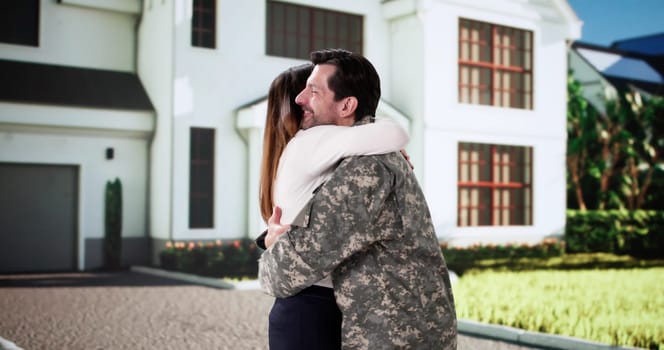 Celebrating the home closing by hugging the veteran army officer.