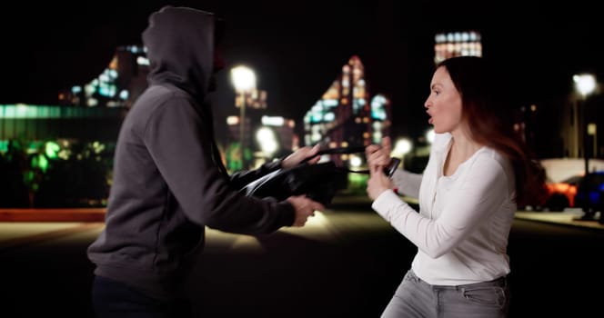 Caught in the Act: Pickpocket Robber Stealing Woman's Bag on Street.