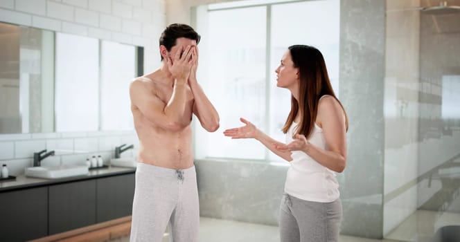 Troubled Pair In Bathroom Arguing Over Infidelity And Separation.