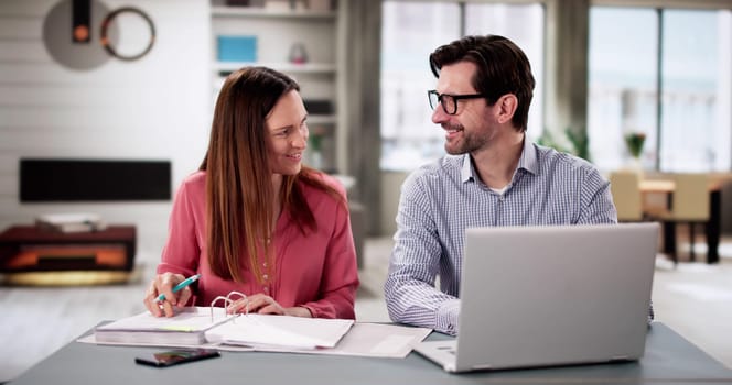 Happy Couple Planning Retirement Finances Together: Budget, Invest, Save.