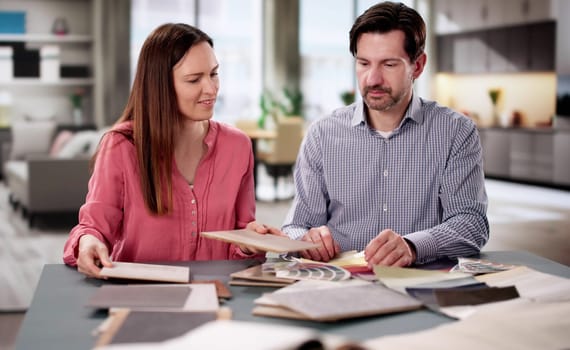Couple Selecting Paint Colors for New Home Interior Design Project