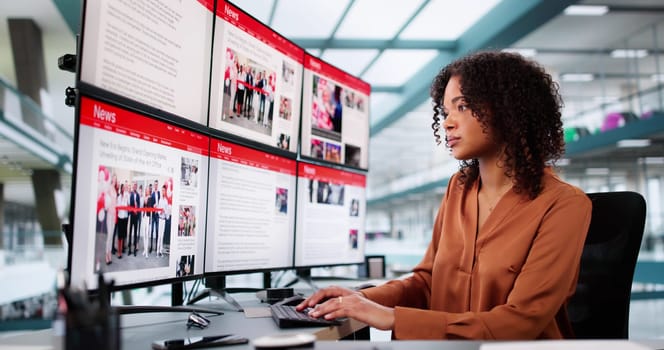 Woman Looking At News In Online Newspaper On Computer