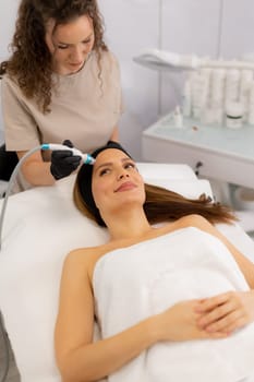 A skilled therapist performs a skin treatment that rejuvenates and hydrates while removing impurities, leaving the client refreshed and relaxed in a tranquil spa atmosphere.