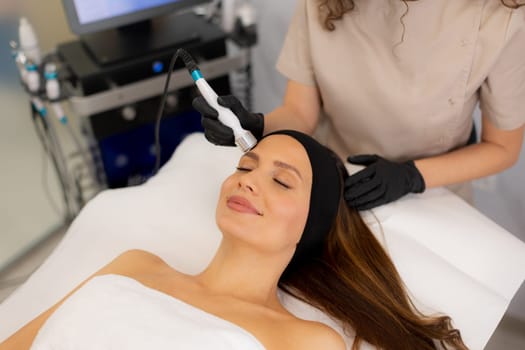 A skilled therapist performs a skin treatment that rejuvenates and hydrates while removing impurities, leaving the client refreshed and relaxed in a tranquil spa atmosphere.