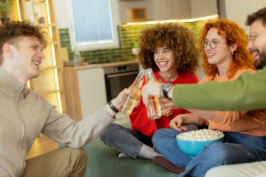 Friends gather in a stylish living room, raising glasses filled with refreshing drinks. They share laughter and warmth while surrounded by a bowl of popcorn, creating joyful memories