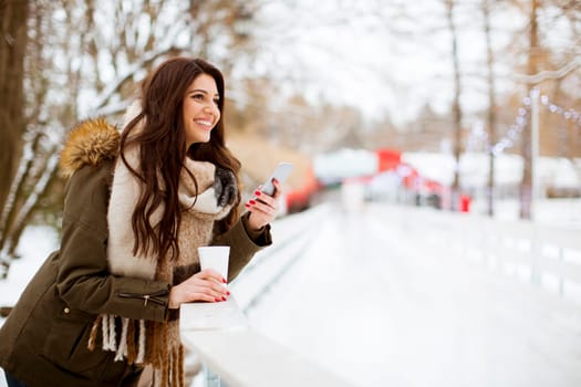 Portrait of young woman in winter park