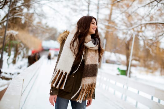 Portrait of young woman in winter park