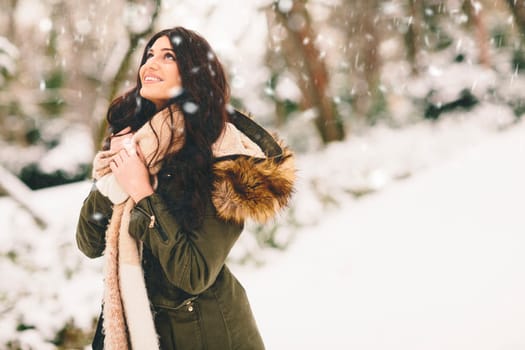 Young woman at cold winter outdoors