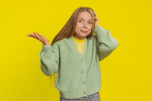 I don't know what to say. Confused Caucasian young woman feeling embarrassed about ambiguous question, having doubts no answer idea, being clueless uncertain. Blonde girl isolated on yellow background