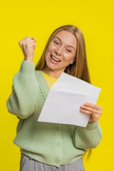 Middle-aged mature woman open envelope take out letter reads it feel happy. Career growth advance promotion, bank loan approve, monetary award, long-awaited invitation great news on yellow background