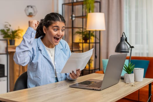 Indian woman open envelope letter reading it. Career growth advance promotion bank loan approve, successful admission to monetary award, long-awaited invitation great news lottery game win. Lifestyle.