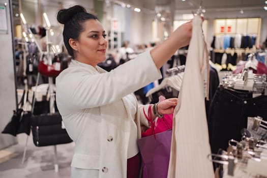 Woman explores the latest fashion trends in a vibrant store.