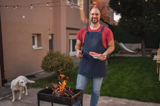 A cheerful outdoor gathering features a grill and friendly vibes.