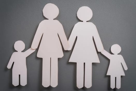 Family with two mothers and two child. LGBT concept. Family of paper cutout figures