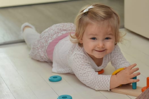 Girl playing with toys in the children's room