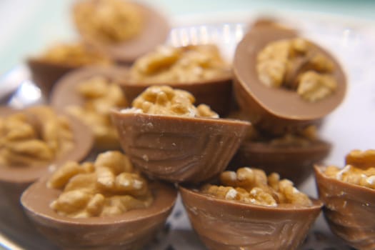 Assorted chocolate candies filled with crunchy nuts ready to enjoy.