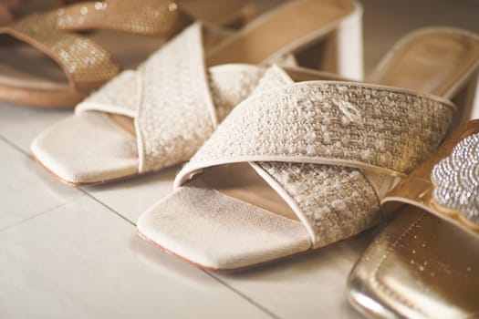 Stylish dress shoes in various designs sit on a clean display surface.