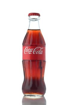 Gaziveren Cyprus -08.03.2025 Glass container showcasing a rich brown beverage, reflecting light, creates a refreshing vibe for any occasion.