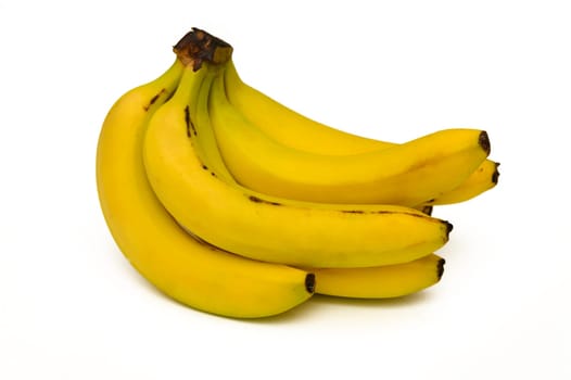 Bright yellow bananas rest together, showcasing their appealing color and ripe texture for health enthusiasts.